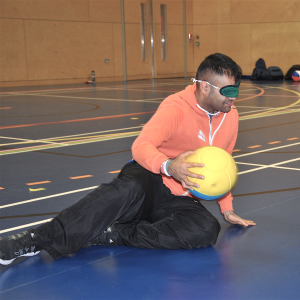 Goalball - blindfolded player holding ball