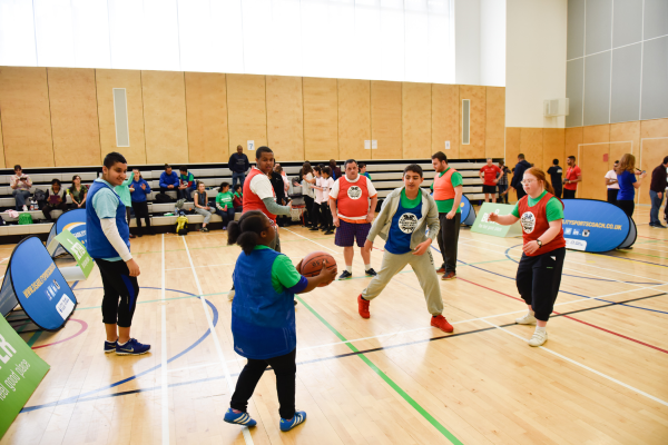 Participants playing basketball
