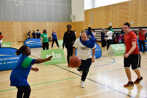 Participants playing basketball