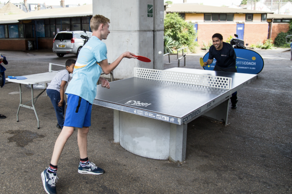Participants playing table tennis